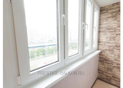 Тёплое остекление балкона профилем КВЕ и комбинированной отделкой пластиком и деревом в Подольске