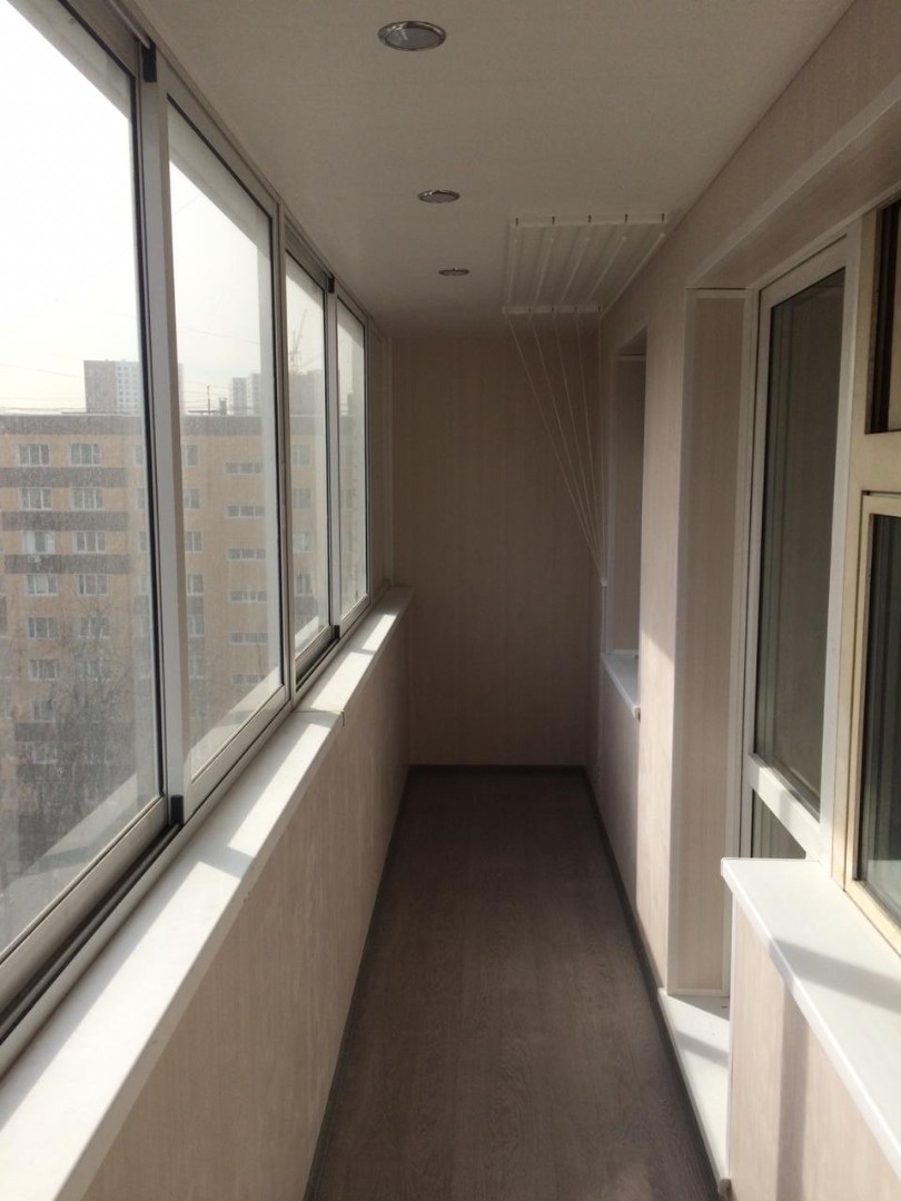 Теплое остекление балкона профилем KBE и установка сушилки в Подольске